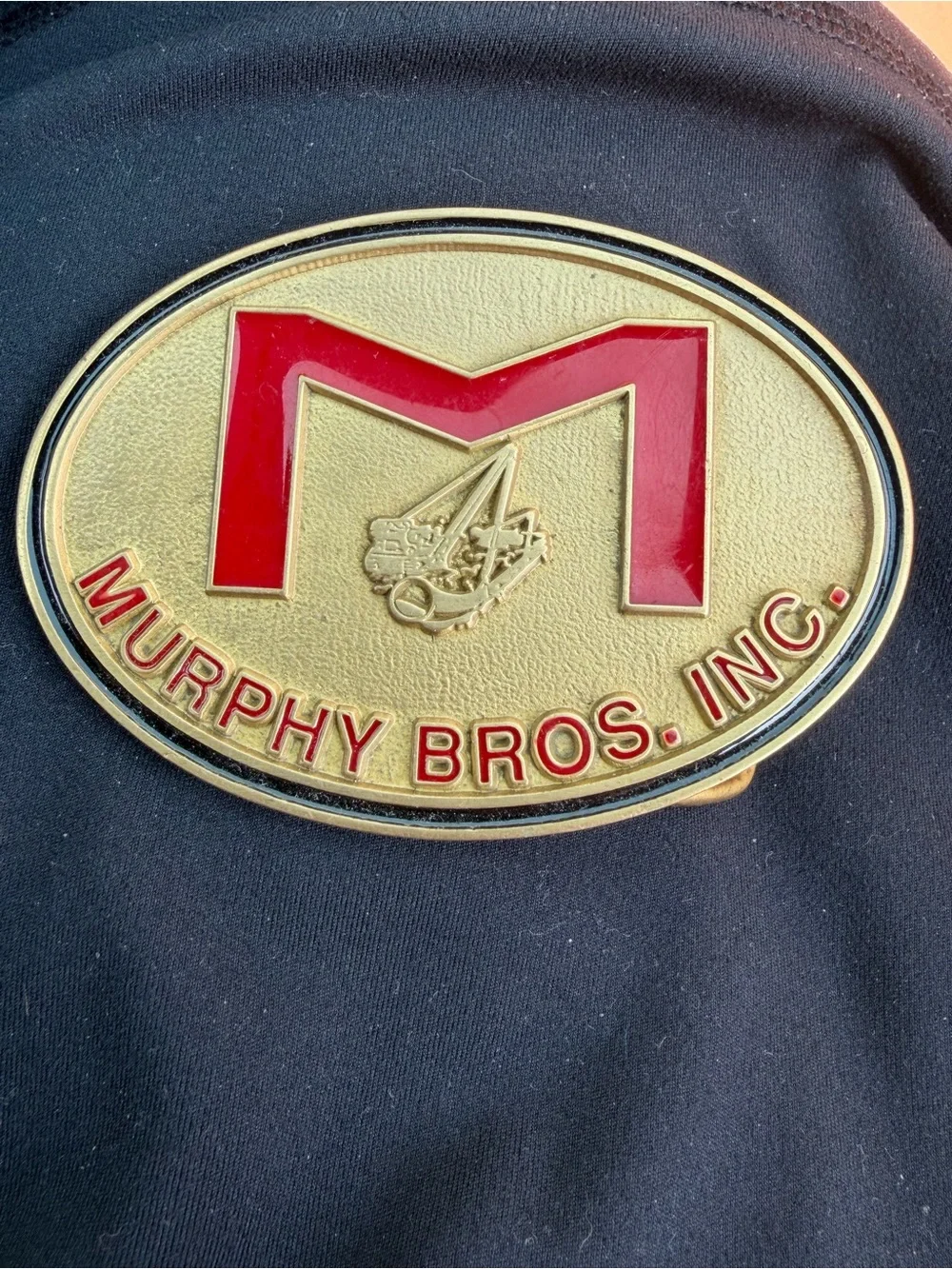 Gold Oval Belt Buckle with Red Accents